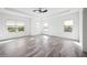 Light and airy bedroom with ample natural light and wood-look tile flooring at 6318 Anise Dr, Sarasota, FL 34238
