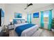 Bright bedroom with turquoise accents, large windows, and stylish decor at 6318 Anise Dr, Sarasota, FL 34238