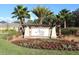Community sign for Arbor Lakes on Palmer Ranch surrounded by flower beds and landscaping at 6318 Anise Dr, Sarasota, FL 34238