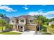 Inviting two-story home featuring a well-maintained lawn and a two-car garage at 6318 Anise Dr, Sarasota, FL 34238