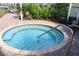Community hot tub with clear water, and steps with a steel handrail for easy entry at 6318 Anise Dr, Sarasota, FL 34238