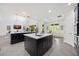 Spacious kitchen with island, stainless steel appliances, and adjacent living space at 6318 Anise Dr, Sarasota, FL 34238