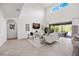 Bright living room with sliding glass doors, high ceilings, and an open layout at 6318 Anise Dr, Sarasota, FL 34238