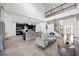 Open-concept living space connecting the living room and kitchen with high ceilings and abundant natural light at 6318 Anise Dr, Sarasota, FL 34238