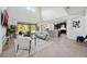 Spacious living room with high ceilings, modern furnishings, and backyard view at 6318 Anise Dr, Sarasota, FL 34238