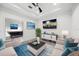 Inviting living room featuring neutral tones, plush seating, and a modern entertainment center at 6318 Anise Dr, Sarasota, FL 34238