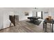 Upstairs loft features a pool table, wood floors, and a dry bar at 6318 Anise Dr, Sarasota, FL 34238