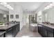 Spacious main bathroom features dual sinks, separate vanities, soaking tub, and walk-in shower at 6318 Anise Dr, Sarasota, FL 34238