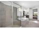Modern main bathroom with soaking tub, glass enclosed shower and dual sinks at 6318 Anise Dr, Sarasota, FL 34238