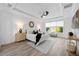 Bright main bedroom features a tray ceiling, wood floors and a large window at 6318 Anise Dr, Sarasota, FL 34238