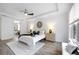 Bright main bedroom features a tray ceiling, wood floors and a window with a bench seat at 6318 Anise Dr, Sarasota, FL 34238