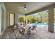 Relaxing covered patio with comfortable seating overlooking the pool at 6318 Anise Dr, Sarasota, FL 34238