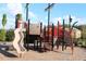 Community playground with multiple structures and a slide, perfect for outdoor play at 6318 Anise Dr, Sarasota, FL 34238