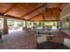 Pool clubhouse featuring vaulted ceilings, exposed wood beam, ceiling fans and seating for large parties at 6318 Anise Dr, Sarasota, FL 34238