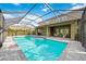 Inviting screened-in pool and patio area, perfect for outdoor relaxation and entertaining at 6318 Anise Dr, Sarasota, FL 34238