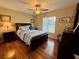 Bedroom with a queen-size bed and hardwood floors at 8026 Barberry Dr, Port Richey, FL 34668