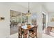 Bright breakfast nook with sliding glass doors leading to patio at 8679 Woodbriar Dr, Sarasota, FL 34238