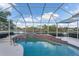 Inviting screened pool with a lake view at 8679 Woodbriar Dr, Sarasota, FL 34238