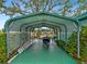 Covered carport with ample space, providing shelter and protection for vehicles and outdoor equipment at 1000 Dartmouth Dr, Bradenton, FL 34207