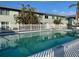 Community pool with surrounding buildings and fence at 10125 Manatee W Ave # D3, Bradenton, FL 34209