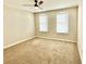 Bright bedroom with neutral walls, carpet flooring, and two large windows at 12439 Trailhead Dr, Bradenton, FL 34211