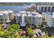 Aerial view of waterfront community with building and parking at 1260 Dolphin Bay Way # 402, Sarasota, FL 34242