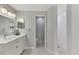 Modern bathroom with walk-in shower and double vanity at 1260 Dolphin Bay Way # 402, Sarasota, FL 34242