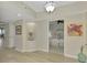 Hallway with light wood floors and bedroom view at 1260 Dolphin Bay Way # 402, Sarasota, FL 34242