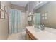 Clean bathroom with light teal shower curtain and decor at 12848 24Th Street E Cir, Parrish, FL 34219