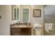 Bathroom featuring granite vanity with mirror and framed art at 1609 Palm View Rd, Sarasota, FL 34240