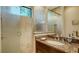 Bathroom featuring a glass shower, granite vanity, and storage at 1609 Palm View Rd, Sarasota, FL 34240