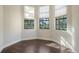 Cozy bedroom with hardwood floors, bright windows, and white trim at 1609 Palm View Rd, Sarasota, FL 34240