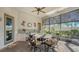 Outdoor dining on the lanai with stone-top table and chairs, sink and mini refrigerator at 1609 Palm View Rd, Sarasota, FL 34240