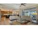 Open-concept living room showcasing views of the dining and kitchen area, plus screened-in lanai at 1609 Palm View Rd, Sarasota, FL 34240