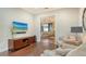 Well lit living room with hardwood flooring and comfortable upholstered seating at 1609 Palm View Rd, Sarasota, FL 34240
