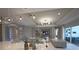 Open-concept design with a view from kitchen island into the living room and access to the patio at 16907 Verona Place, Lakewood Ranch, FL 34202