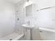 Clean bathroom with marble shower and pedestal sink at 1756 Livingstone St, Sarasota, FL 34231