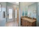 Bathroom features a glass shower, vanity, and access door at 2123 Calusa Lakes Blvd, Nokomis, FL 34275