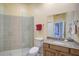 This bathroom features a large shower, vanity, and mirror at 2123 Calusa Lakes Blvd, Nokomis, FL 34275