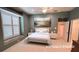 Virtually staged bedroom features a window seat and closet at 2123 Calusa Lakes Blvd, Nokomis, FL 34275