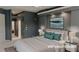 Bedroom with neutral carpet, ensuite access, and modern decor, virtually staged for appeal at 2123 Calusa Lakes Blvd, Nokomis, FL 34275