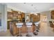 This gourmet kitchen has wood cabinets, granite countertops, and stainless steel appliances at 2123 Calusa Lakes Blvd, Nokomis, FL 34275