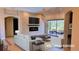 Bright living room featuring fireplace, tiled flooring, modern furniture, and access to a screened lanai at 2123 Calusa Lakes Blvd, Nokomis, FL 34275