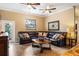 Comfortable living room featuring a leather sectional and coffee table at 2408 51St E Blvd, Bradenton, FL 34208