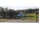 Aerial view of a residential area with storm-damaged properties and vacant land at 2815 Us-41 N, Palmetto, FL 34221