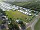 Expansive aerial view showcasing an organized community, lush greenery, and homes with beautiful landscaping at 2815 Us-41 N, Palmetto, FL 34221