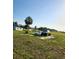 Wide lot with two vehicles, one large, and a single-story home in the background at 2815 Us-41 N, Palmetto, FL 34221