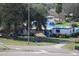 Exterior of damaged home with blue tarp on roof at 2815 Us-41 N, Palmetto, FL 34221