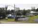 House exterior showing storm damage with blue tarp covering roof at 2815 Us-41 N, Palmetto, FL 34221