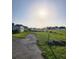 The wide, grassy property has an older house on it with other homes in the distance at 2815 Us-41 N, Palmetto, FL 34221